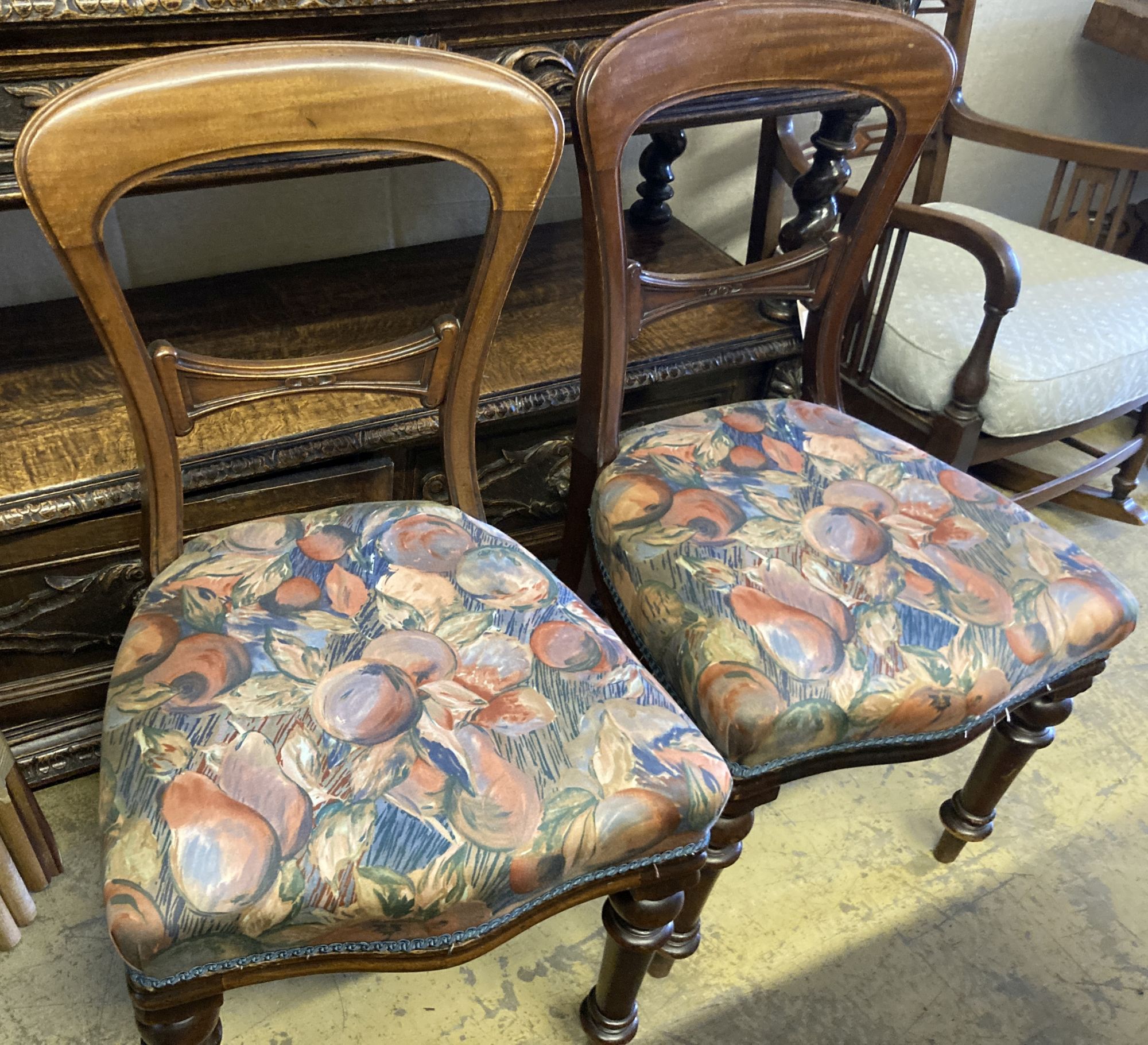 A Victorian rosewood oval tilt top loo table, length 150cm, depth 110cm, height 74cm and a matched set of six Victorian mahogany balloo